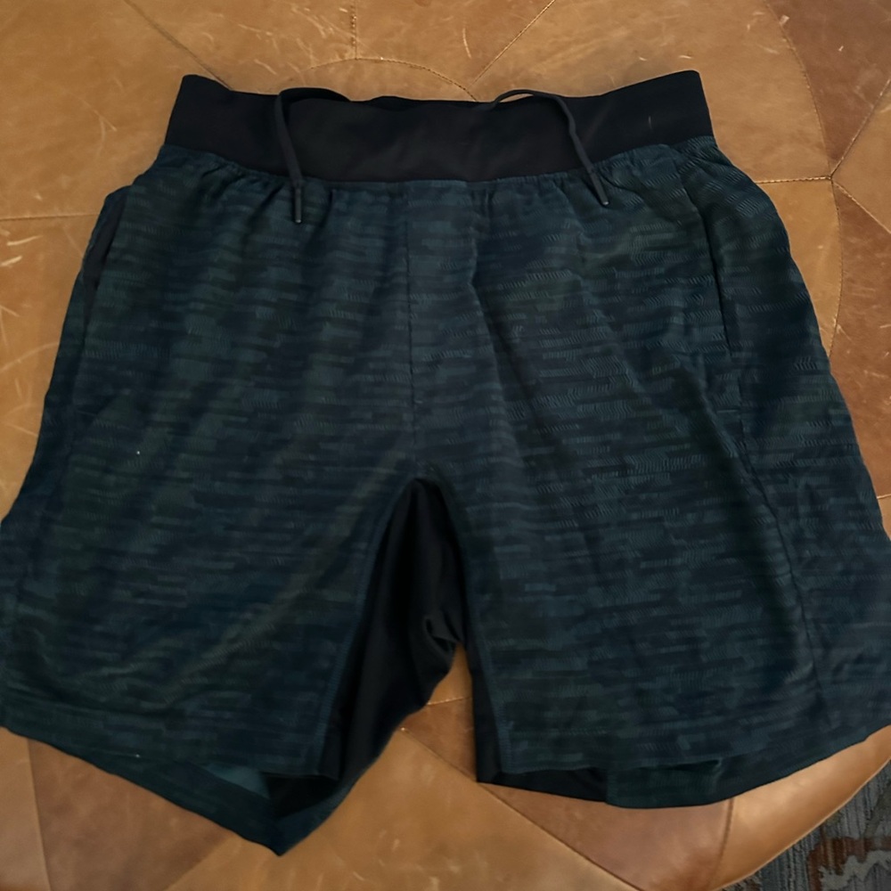 Lululemon green and black T.H.E. shorts 7”